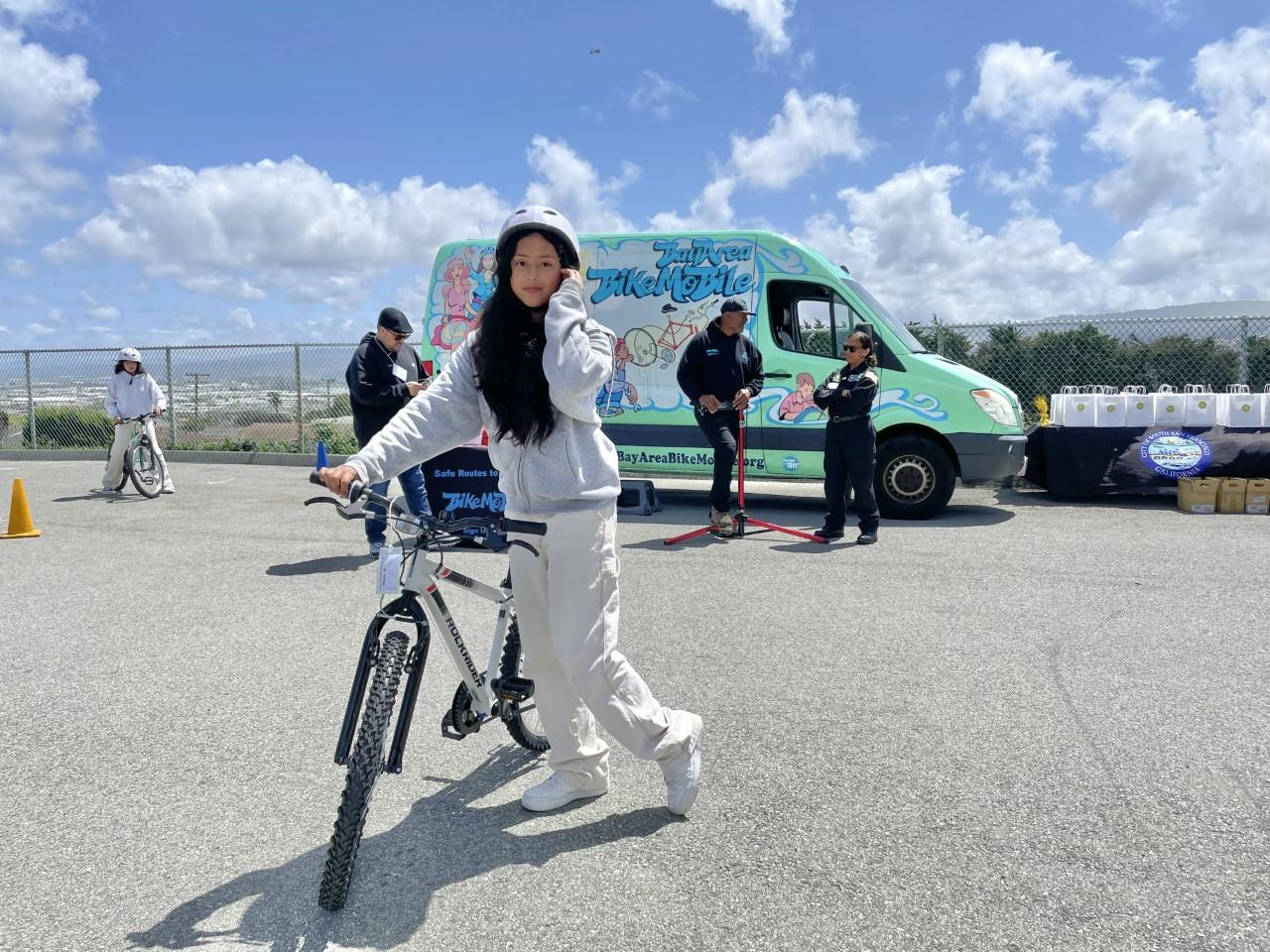 Parkway Heights Middle School sixth grader Alisson Ganuza receives a bicycle through the City of South San Francisco's "Every Kid Deserves a Bike" program on May 8, 2023.