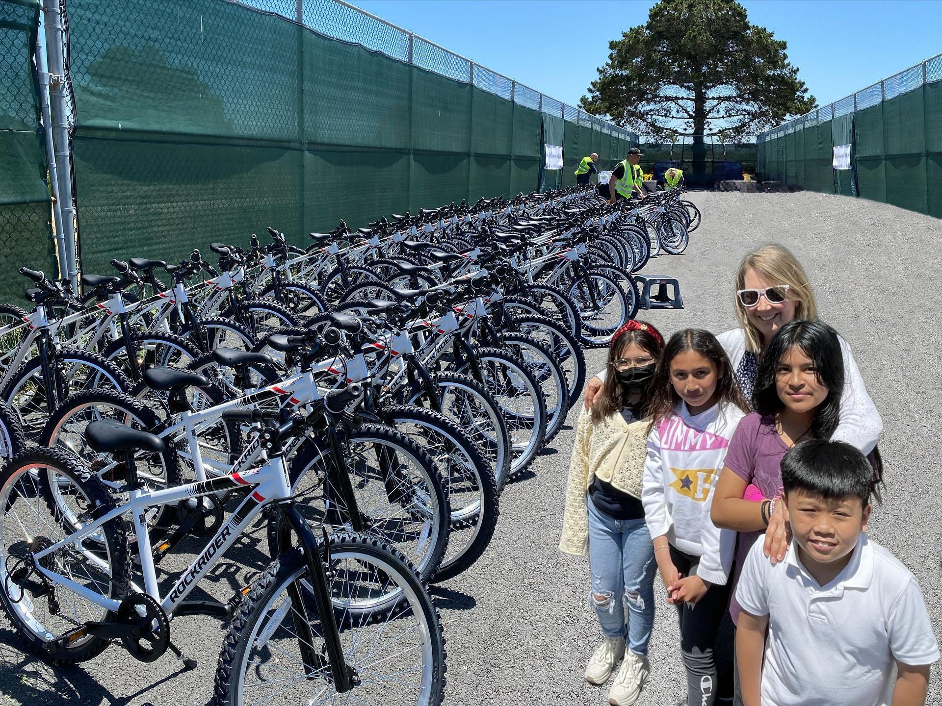 Los Cerritos Elementary School Principal Marybeth McLaughlin with students at the city of South San Francisco's 2023 bike giveaway event.
