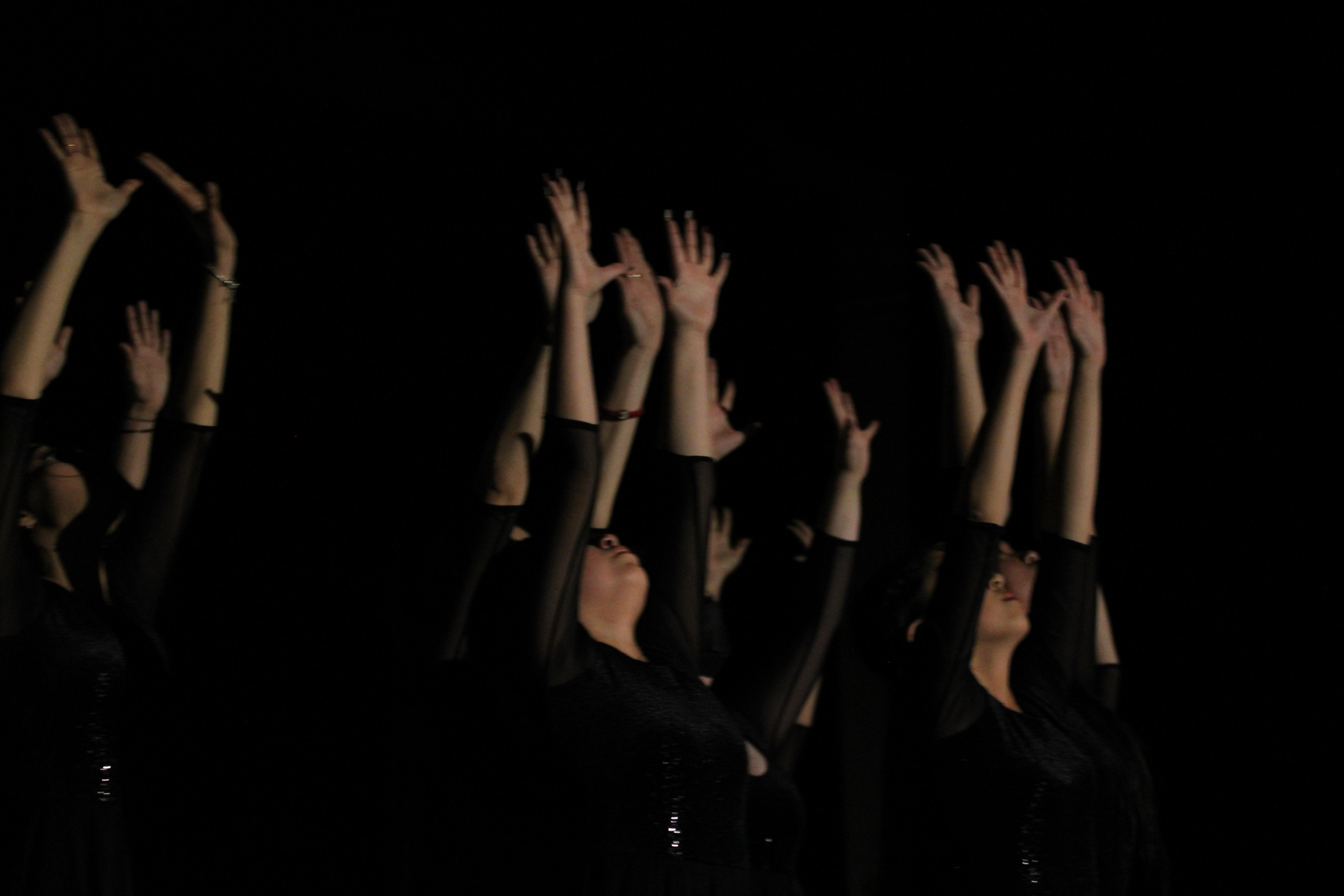 South City High dancers play with shadows during the school's spring 2023 recital.