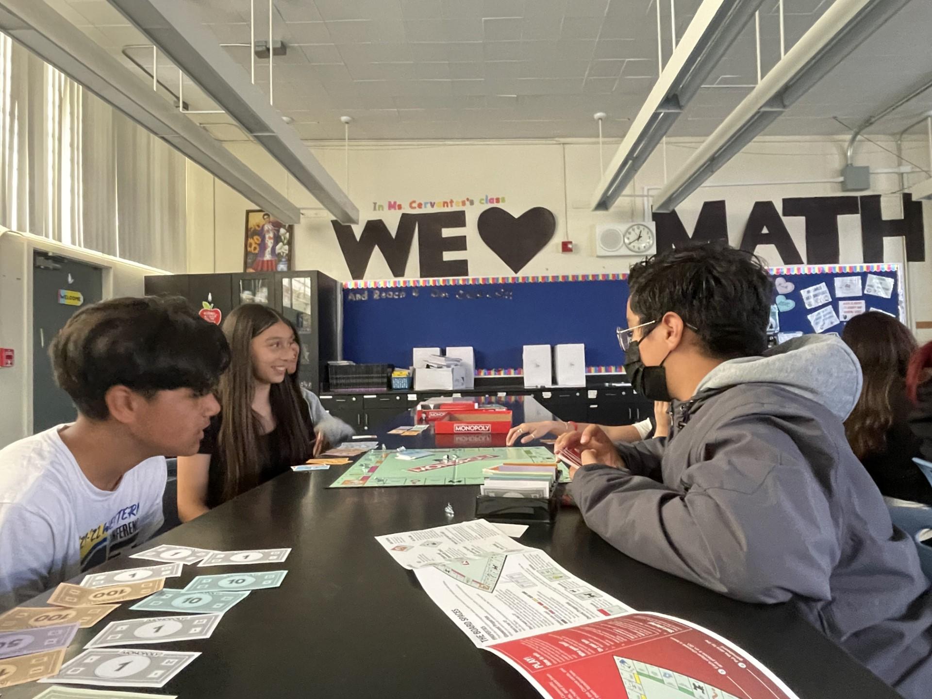 Seventh and eighth grade students at Parkway Heights Middle School play Monopoly to learn about personal finance as part of the district's new financial literacy class.