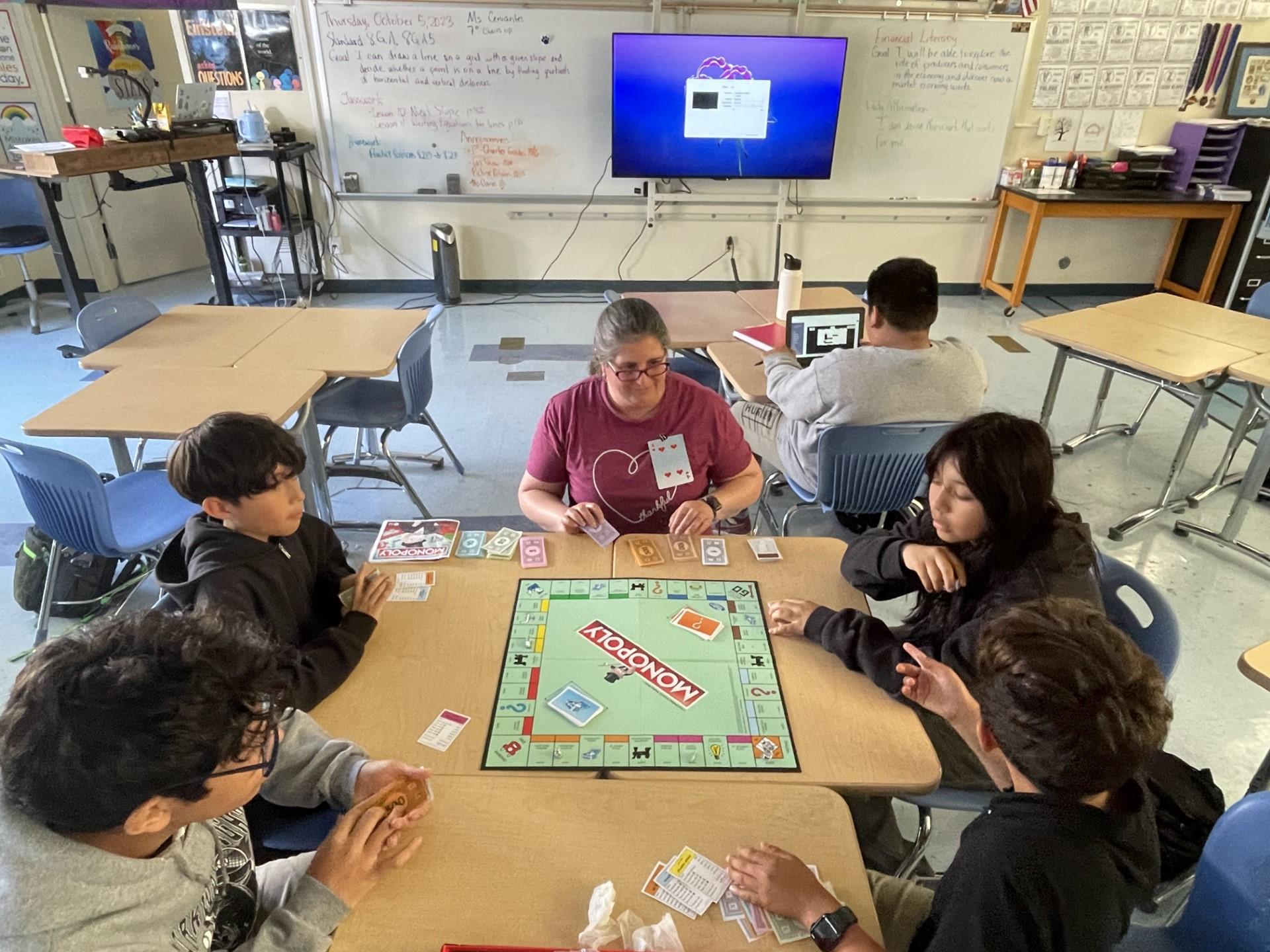Seventh and eighth grade students at Parkway Heights Middle School play Monopoly to learn about personal finance as part of the district's new financial literacy class.