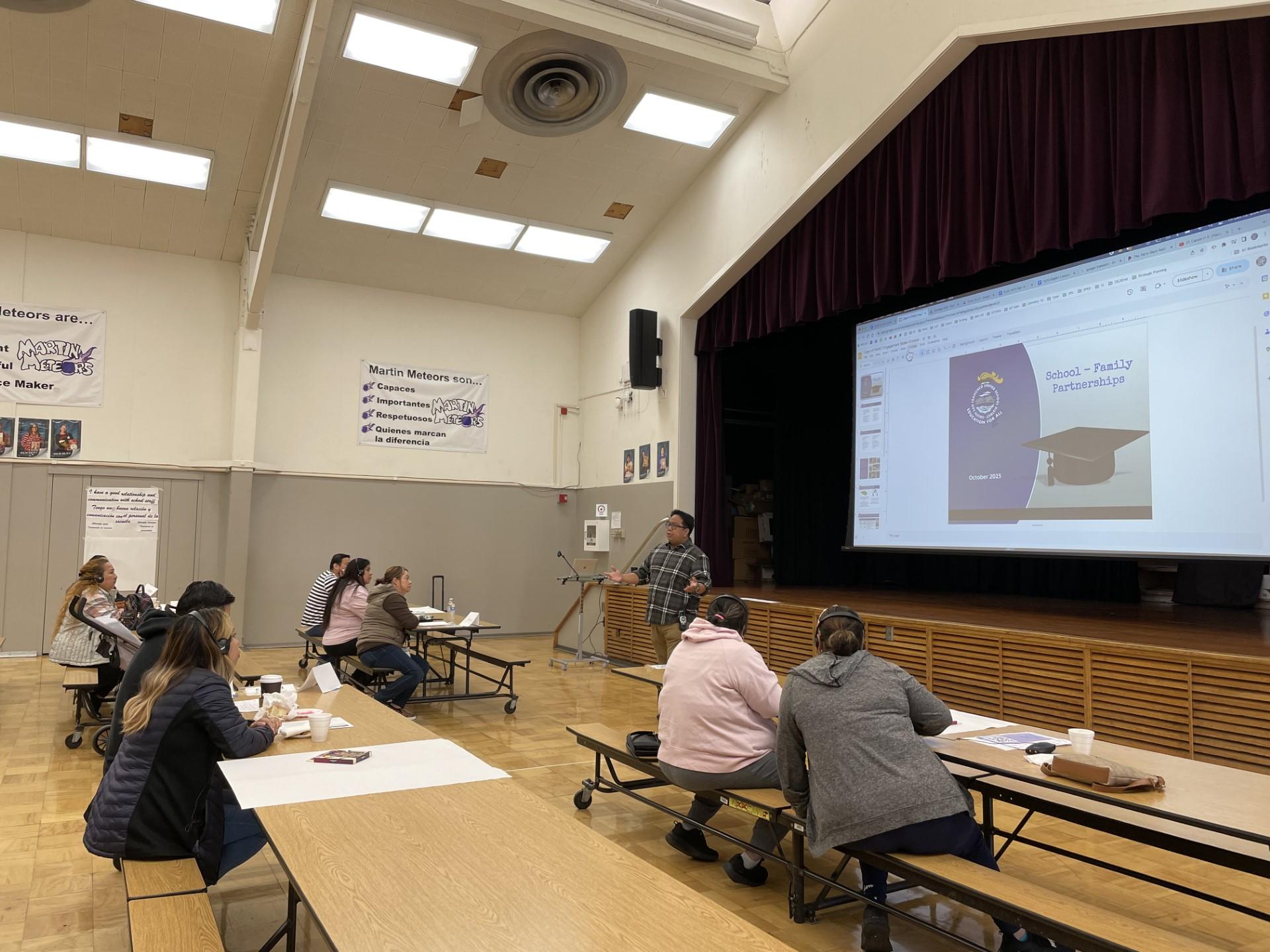 Martin Elementary School Principal Jonathan Covacha engages the school's Spanish-speaking parents in conversation about SSFUSD's new strategic plan.