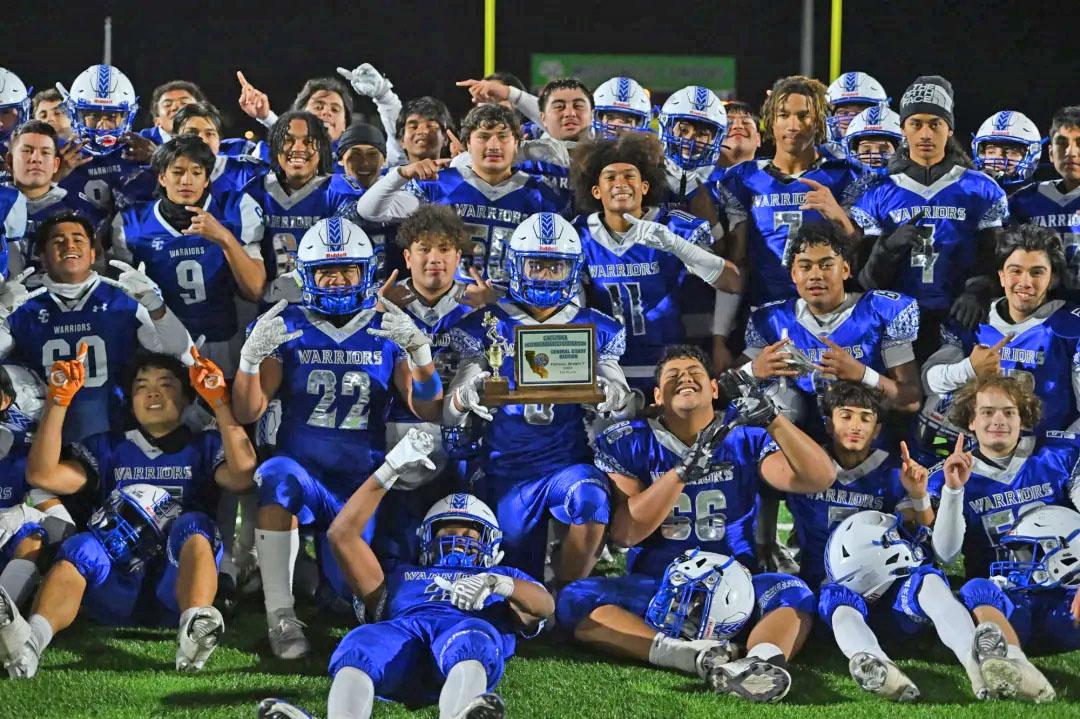 The South San Francisco Warriors pose with the first place trophy after defeating Santa Teresa during their CCS Division V high school football championship game at MacDonald High School in San Jose, Calif., on Saturday, Nov. 25, 2023. South San Francisco defeated Santa Teresa 13-7. (Jose Carlos Fajardo/Bay Area News Group)
