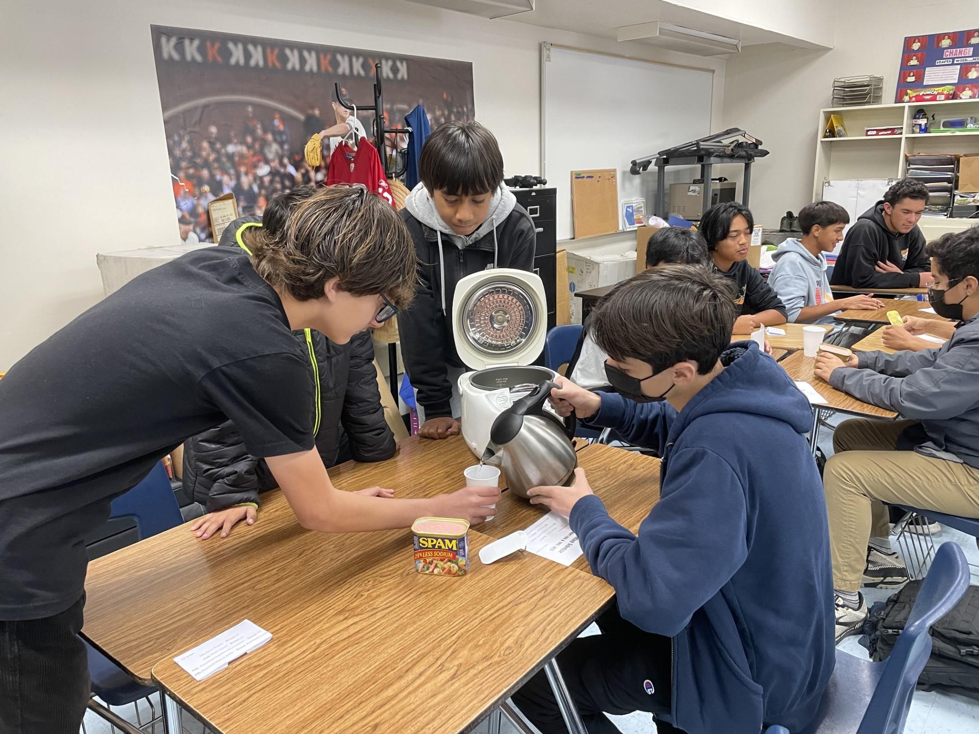 Parkway Heights Middle School students make SPAM masubi during the school's annual intercession event.